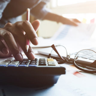 Staff Boom Claims Administrators Page Banner - Corporate Man Using Calculator