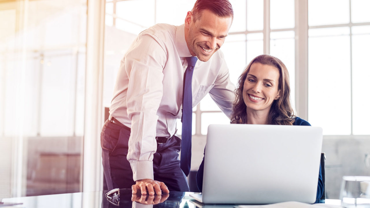 Staff Boom Insurance Agents & Brokers Page Banner - Corporate Man and Woman Smiling
