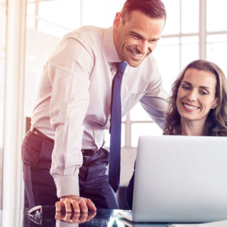 Staff Boom Insurance Agents & Brokers Page Banner - Corporate Man and Woman Smiling